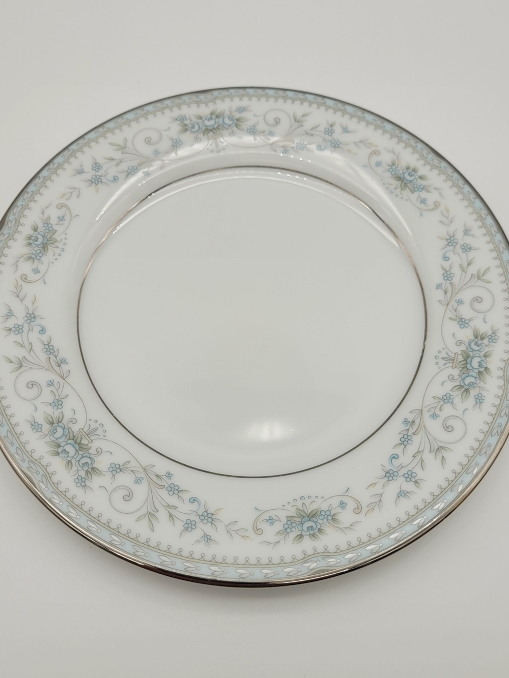 Noritake 6107 White Dinner Plate with Light Blue Floral Silver Trim